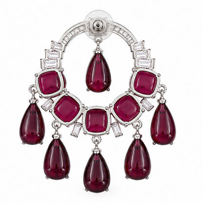 Four pairs of earrings displayed on a white background: two chandelier-style drop earrings with green stones at the top left, two chandelier-style drop earrings with red stones at the top right, and two matching dangle earrings with green stones at the bottom left, and two matching dangle earrings with red stones at the bottom right.