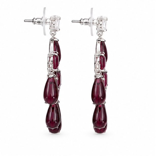 Four pairs of earrings displayed on a white background: two chandelier-style drop earrings with green stones at the top left, two chandelier-style drop earrings with red stones at the top right, and two matching dangle earrings with green stones at the bottom left, and two matching dangle earrings with red stones at the bottom right.