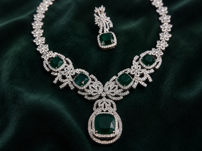 Luxury emerald green cubic zirconia statement necklace set with matching drop earrings for weddings, receptions, festive occasions, sarees and lehengas.