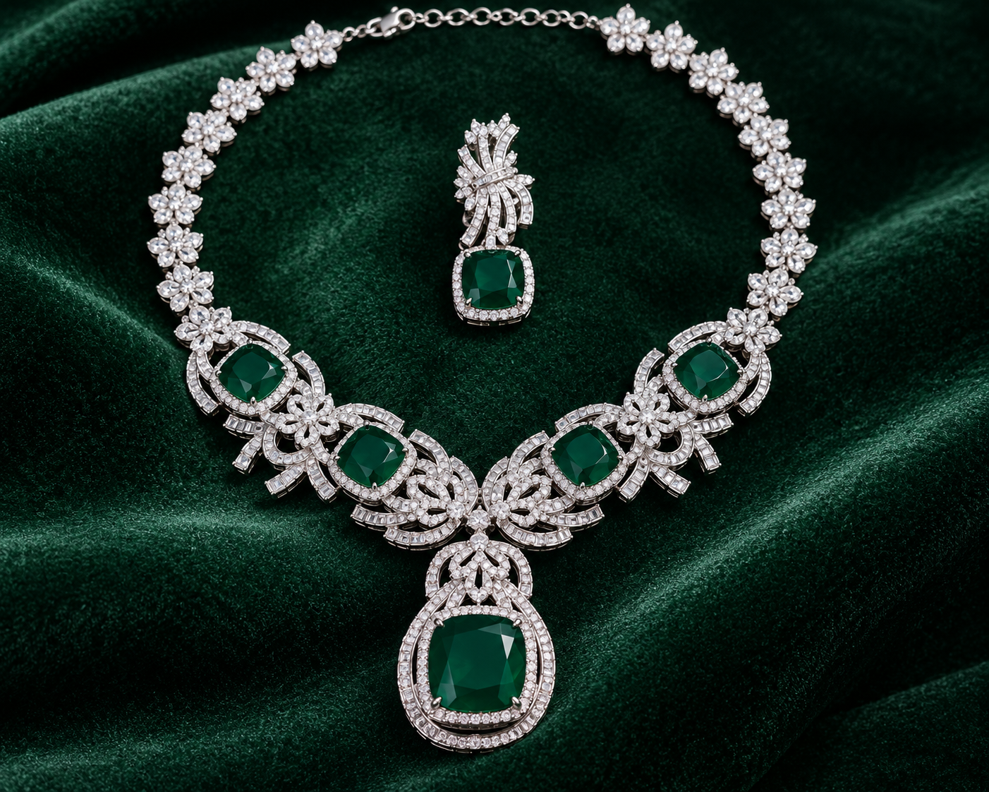 Luxury emerald green cubic zirconia statement necklace set with matching drop earrings for weddings, receptions, festive occasions, sarees and lehengas.
