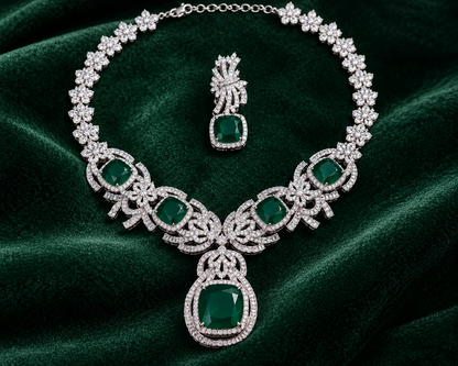 Luxury emerald green cubic zirconia statement necklace set with matching drop earrings for weddings, receptions, festive occasions, sarees and lehengas.