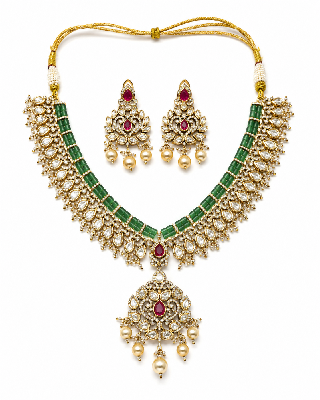 Emerald green Kundan bridal necklace set with ruby accents, pearl drops and matching statement earrings for weddings, bridal wear, sarees and lehengas.