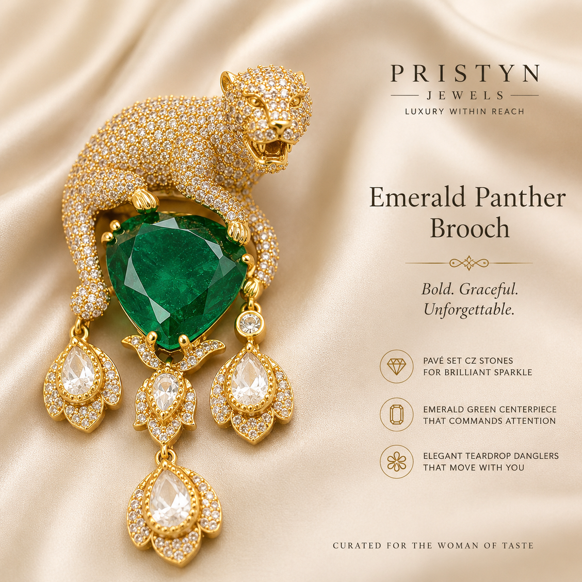 A luxury jewelry advertisement for the Prystyn Jewels Emerald Panther Brooch. The brooch features a gold-toned panther body paved with small clear stones, a large faceted emerald green heart-shaped center stone, and three dangling teardrop-shaped clear gemstones.