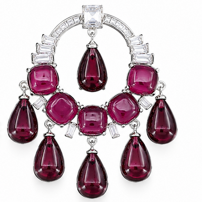 A pair of large, ornate chandelier earrings featuring emerald-cut green and round-cut pink gemstones in a silver-tone setting with clear accent stones, displayed on a clean white background.