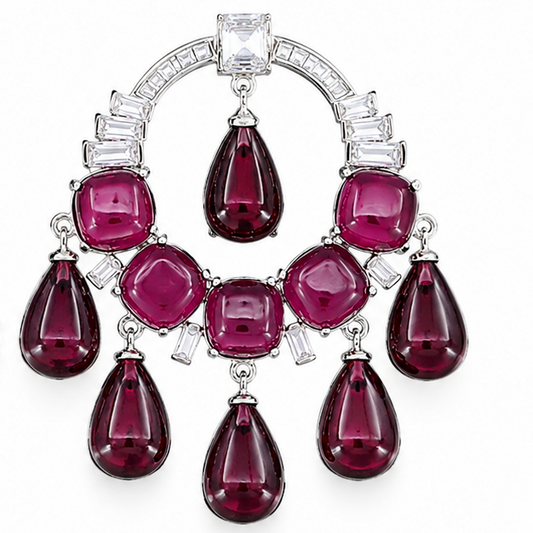 A pair of large, ornate chandelier earrings featuring emerald-cut green and round-cut pink gemstones in a silver-tone setting with clear accent stones, displayed on a clean white background.