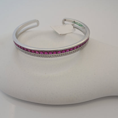 Silver bracelet with pink stones on a white mannequin arm
