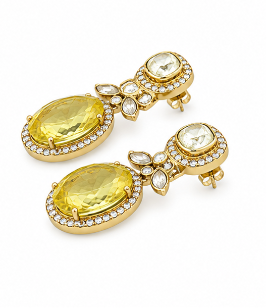 A set of gold drop earrings with large oval yellow gemstones and small clear stones, shown from multiple angles on a plain white background.